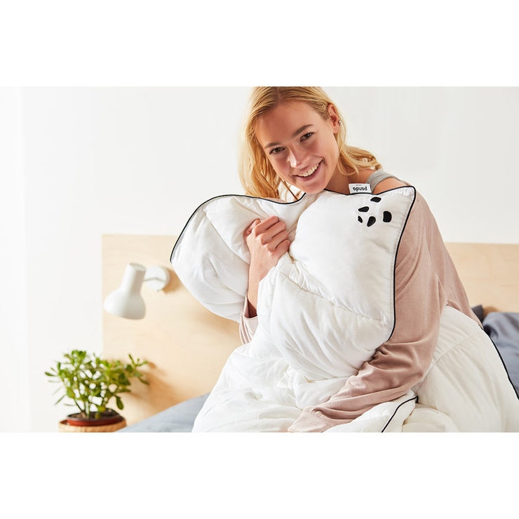 Woman hugging duvet