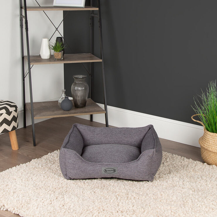 Lifestyle image of empty pet bed in living room setting