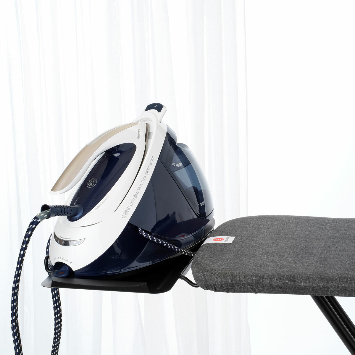 lifestyle image of brabantia ironing board close up with an iron on the rest