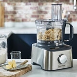 Lifestyle image of Kenwood Multipro Compact Plus Food Processor using the bowl Lifestyle image of Kenwood Multipro Compact Plus Food Processor using the bowl