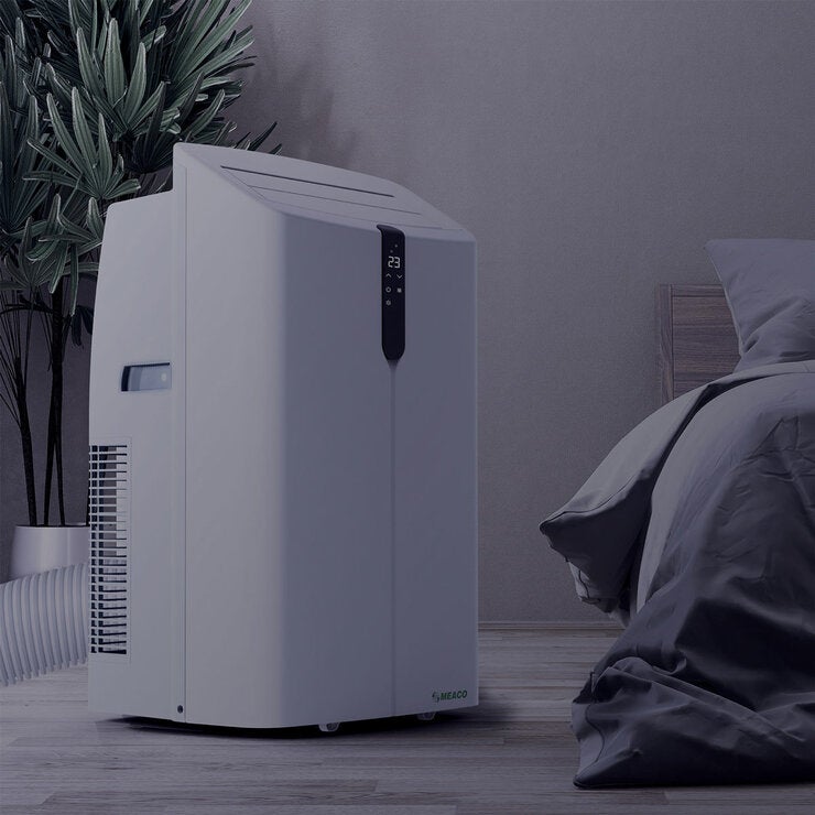 Lifestyle image of air conditioner in bedroom at night Lifestyle image of air conditioner in bedroom at night
