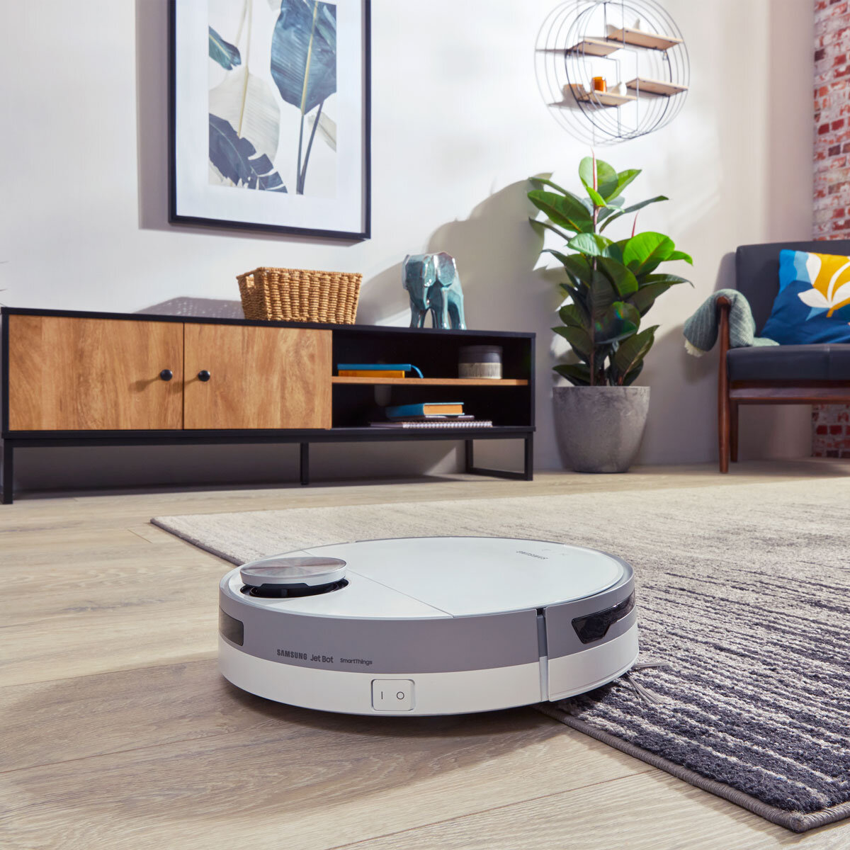 Lifestyle image of Samsung Robotic Vac on carpet