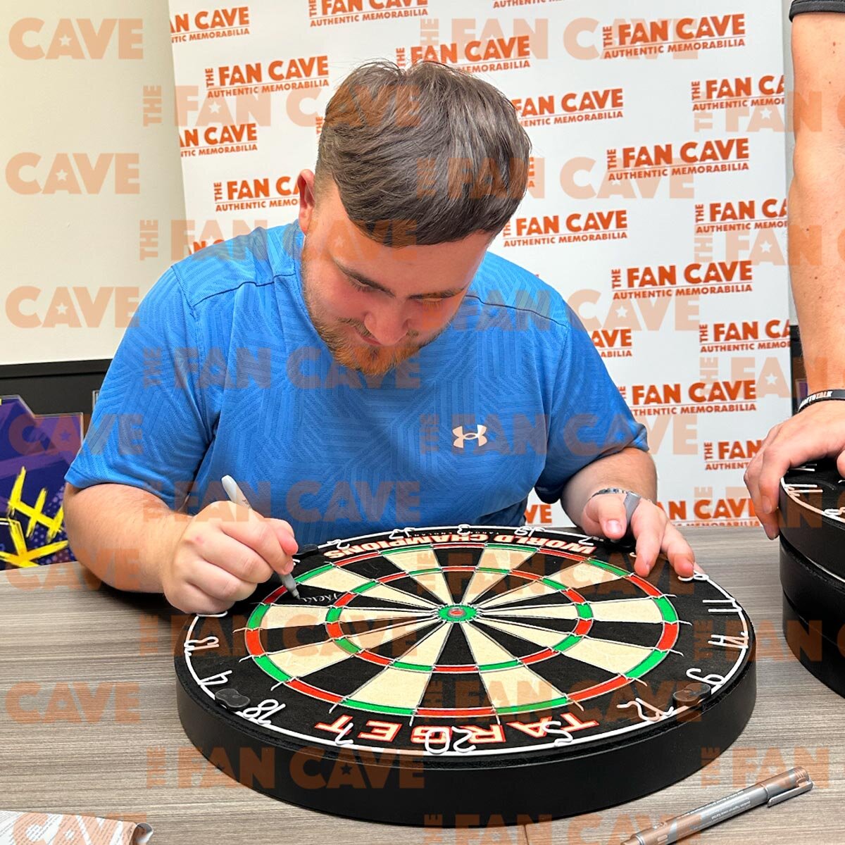 Luke Littler Signed Dartboard Frame, including 2 Photos