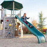 Lifestyle image of a child going down the slide Lifestyle image of a child going down the slide