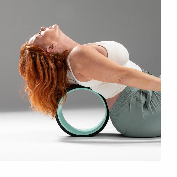 Lifestyle image of a woman using a wheel on her back