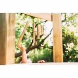 Lifestyle image of a child playing with the wind chimes Lifestyle image of a child playing with the wind chimes