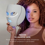 Lifestyle image of model holding the mask