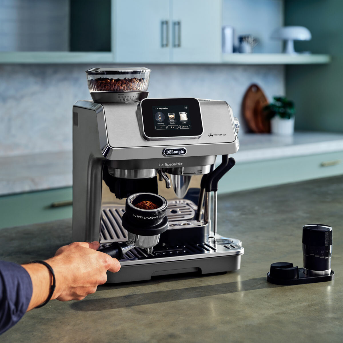 Lifestyle images of De'Longhi La Specialista Touch Coffee Machine being used on a kitchen countertop