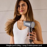 Lifestyle image of model using Airmotion High Speed Ionic Hair Dryer With Heat Control & Diffuser