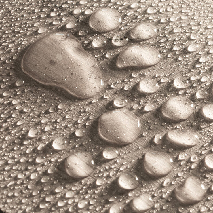 Close up image of planks with water on surface