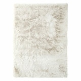 Cream-coloured fluffy textured rug