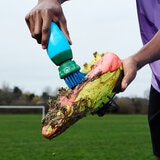 Lifestyle image of someone scrubbing their shoe
