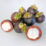 Mangosteens on a Table