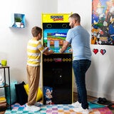 Lifestyle image of a man and child playing on the machine