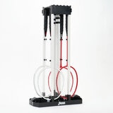 Studio image of the badminton base folded down and the rackets stood inside it.