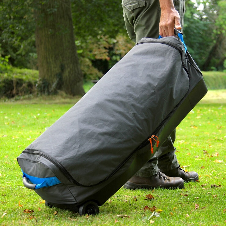 Lifestyle image of the Coleman Cortes Octagon Tent in the wheeled carry bag