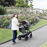 Lifestyle image of a woman pushing the stroller