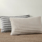 XL ribbed pillows with a plush texture resting on a textured floor