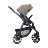 Studio image of the stroller from the side, footrest lowered