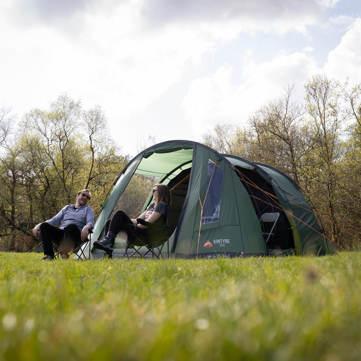 Lifestyle image of people sat under the tent canopy Lifestyle image of people sat under the tent canopy