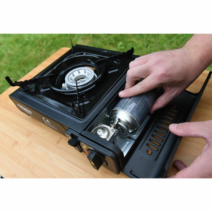 Lifestyle image of someone loading a gas cartridge