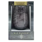Lifetsyle image of grey candle in packaging face on
