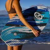 Lifestyle image of a woman holding the skimboard Lifestyle image of a woman holding the skimboard