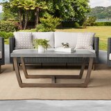 Coffee table and sofa with cushions