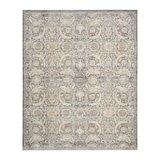 Grey and beige rug with detailed symmetrical pattern and vintage-style accents Grey and beige rug with detailed symmetrical pattern and vintage-style accents