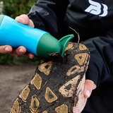 Lifestyle image of someone using the scraper