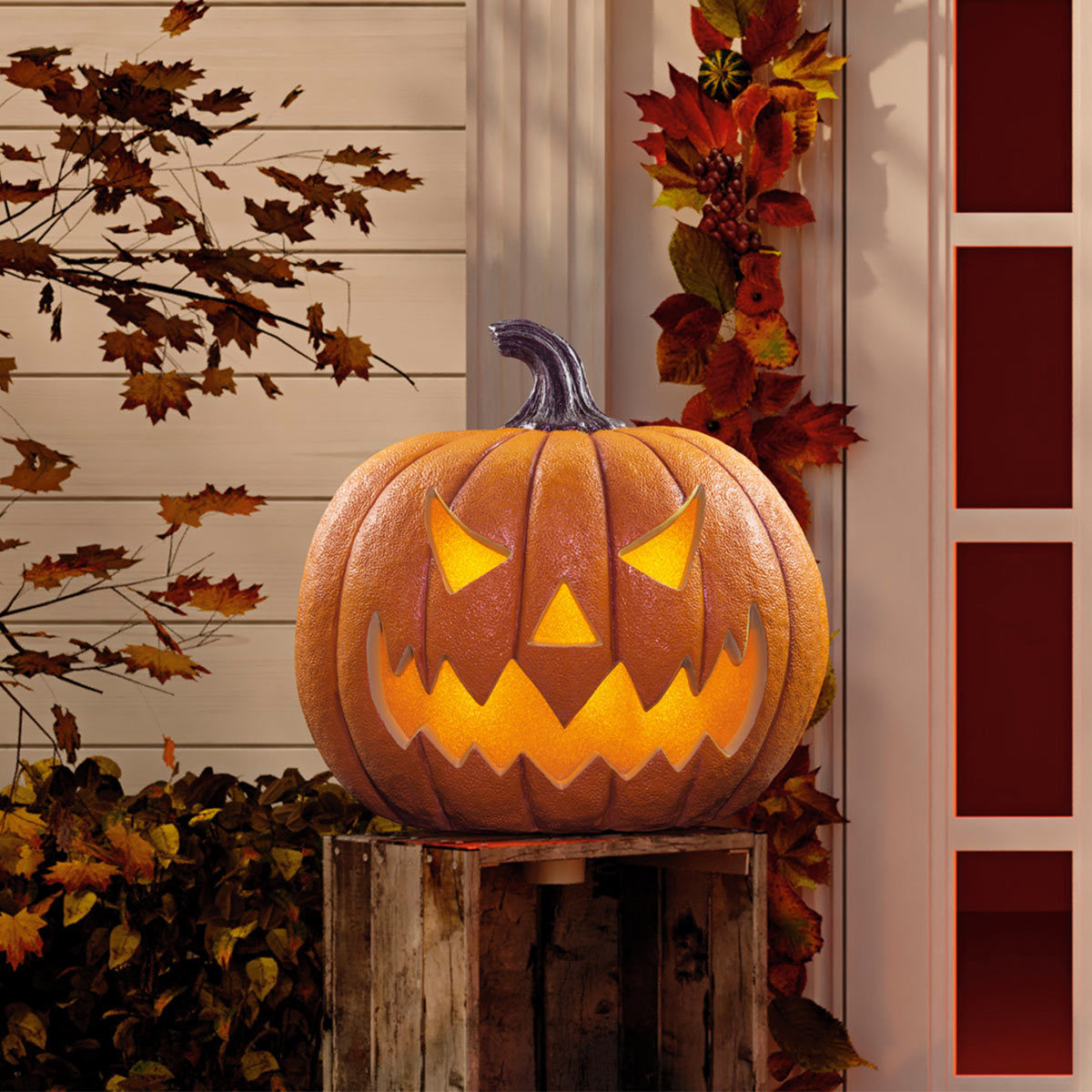 Jack O lantern pumpkin halloween decoration outside on natural background