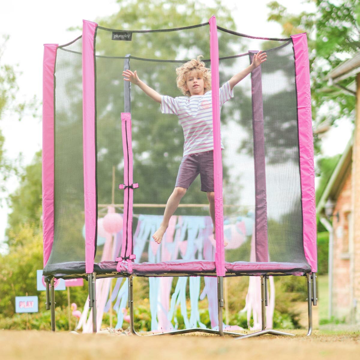 Lifestyle image of a child jumping on the trampoline
