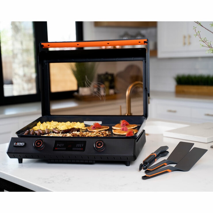 Lifestyle image of electric griddle on kitchen counter from wide view Lifestyle image of electric griddle on kitchen counter from wide view