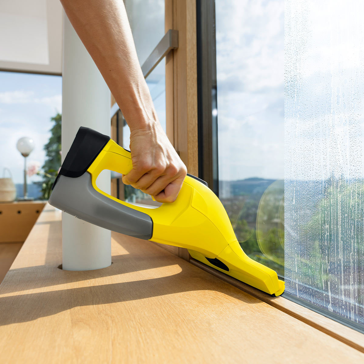lifetsyle of window vaccum being used on a window