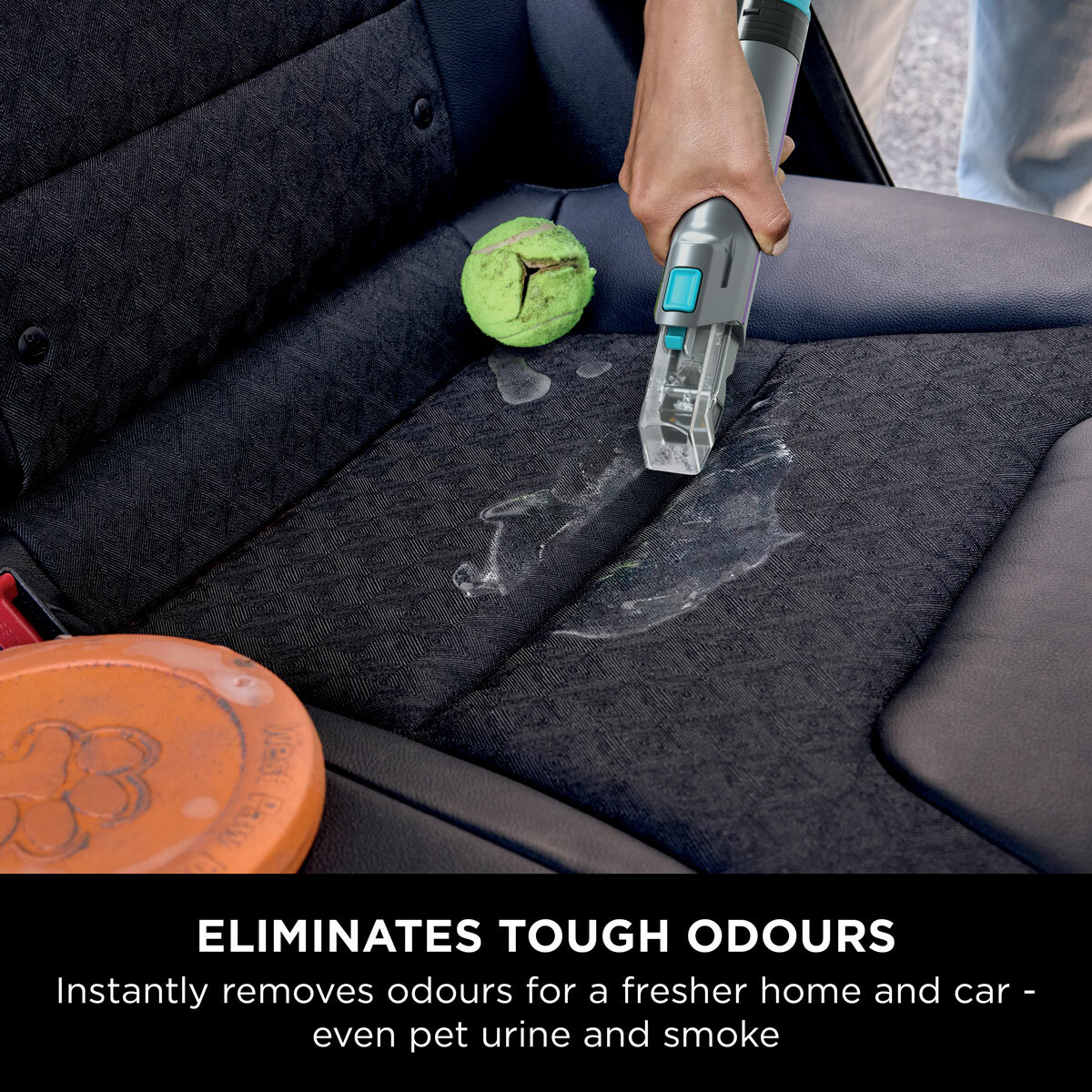 Lifestyle image of Shark StainStriker HairPro Pet Stain & Spot Cleaner being used on car seats
