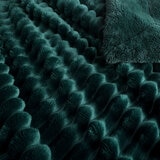 Zoomed in imagery of dark green ribbed throw, texured and soft Zoomed in imagery of dark green ribbed throw, texured and soft