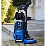 Lifestyle image of pressure washer freestanding on patio