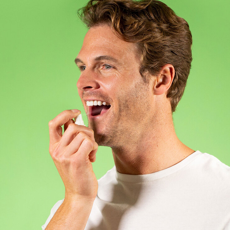 Man Spraying into Mouth