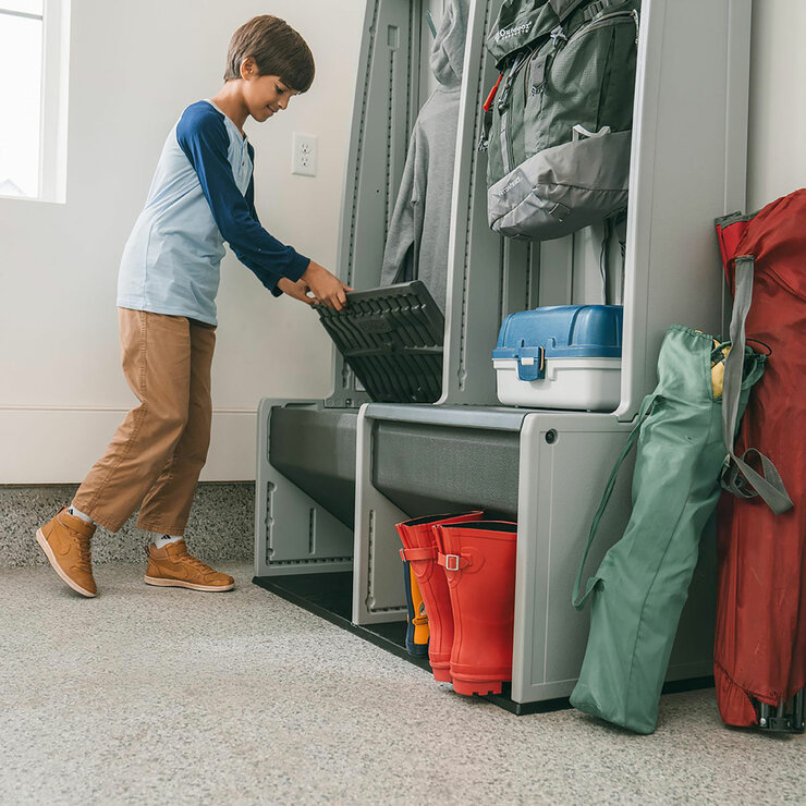 Lifestyle image showing a child lifting the seat on the storage locker Lifestyle image showing a child lifting the seat on the storage locker