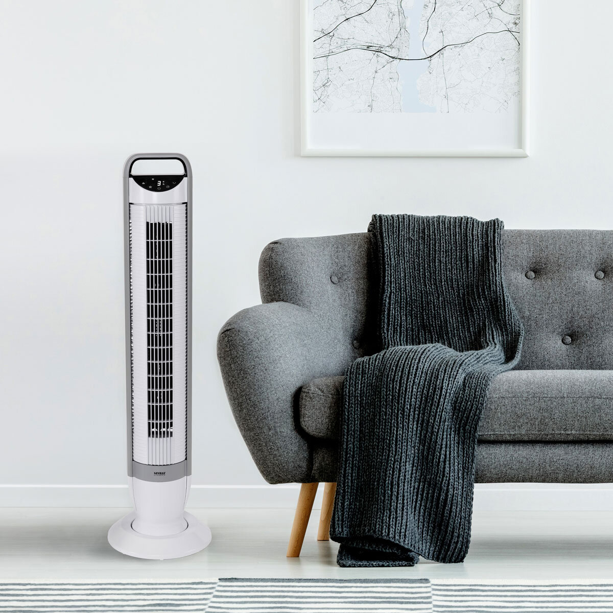 Lifestyle image Seville Slimline Digital Fan with sofa