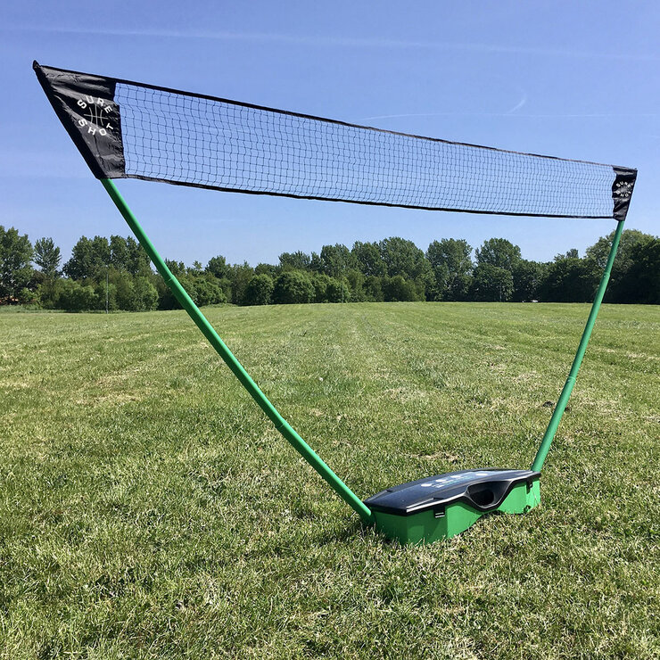 Lifestyle image of the badminton net set up outside